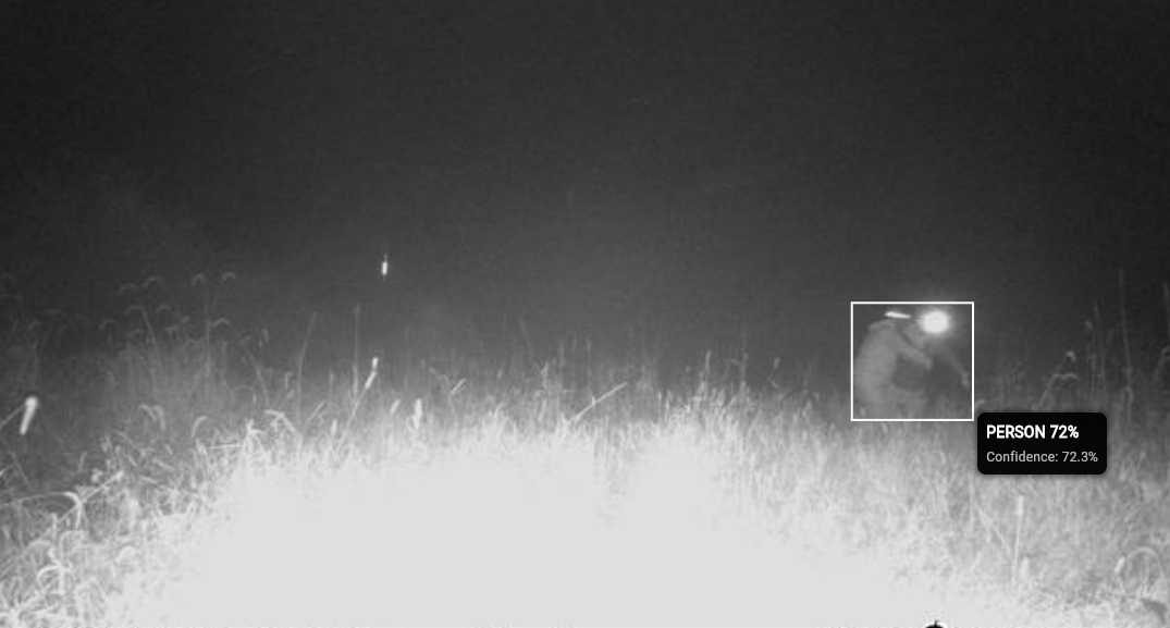 AI detected human with bounding box at night